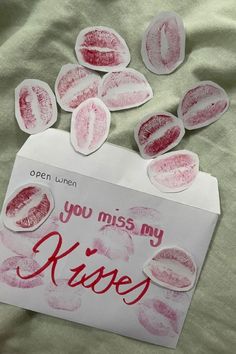 a piece of paper that says you miss my kisses on it with some stickers stuck to it