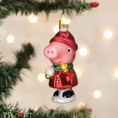 a pig ornament hanging from a christmas tree