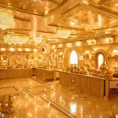 an elaborately decorated dining room with chandeliers and gold decorations on the ceiling