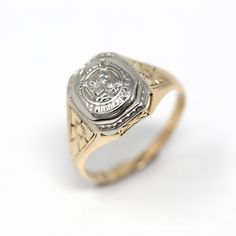 Lovely antique dated 1927 Art Deco era 14k yellow and white gold signet ring! This stylish statement ring is is adorned with floral designs on each shoulder. The ring face reads Minneapolis High School with a school emblem on the front. The inside of the ring band is sweetly engraved 'L.E.J. - 27.' A fantastic piece of fine Art Deco era dated jewelry! *Sale - price reduced from $425 USD to $395 USD.  ERA - Dated 1927 - Art Deco  METAL / MATERIAL - 14k yellow & white gold MARKINGS / HISTORY - Ins Victorian 14k Gold Diamond Cut Rings, Classic Hallmarked Signet Ring Collectible, Classic Hallmarked Signet Ring For Collectors, Collectible Yellow Gold Engraved Ring With Hallmarks, Collectible Engraved Yellow Gold Ring With Hallmarks, Classic Engraved Ring With Hallmarks, Classic Engraved Signet Ring For Commemoration, Classic Hallmarked Signet Ring For Commemoration, Antique Yellow Gold Wedding Ring Stamped 14k