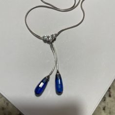 14 Karat White Gold Lariat Necklace, Approximately 20 Inches With Blue Color Sapphire Stones And Three Cz‘s Absolutely Beautiful. Also Has A Lobster Claw Clasp. Gold Lariat Necklace, Sapphire Stones, Colored Stones, Sapphire Color, Sapphire Stone, Lariat Necklace, Lobster Claw, Red Gold, Blue Gold