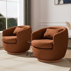 two orange chairs sitting next to each other on a rug in front of a window