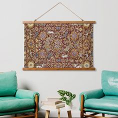 a living room with two chairs and a rug hanging on the wall