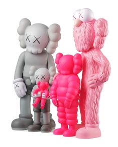 three toy figurines are standing next to each other, one is holding an infant