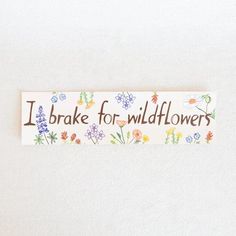 i brake for wildflowers sticker on a white background with flowers and butterflies