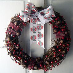 a wreath is hanging on the front door