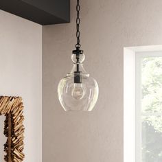 a light fixture hanging from the ceiling in a room