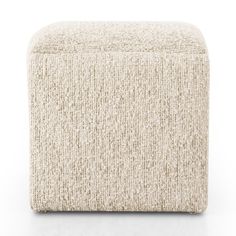 the footstool is made out of wool and has a thick, chunky texture