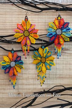 These beautiful handmade earrings are made by indigenous artisans from Chiapas, Mexico. They are unique, lightweight, and perfect for any occasion. They also make great gifts! Get up to 40% off on our products until June 14th. Multicolor Bead Cap Drop Earrings, Multicolor Drop Earrings With Bead Caps, Unique Multicolor Beaded Flower Earrings, Unique Multicolor Flower-shaped Beaded Earrings, Multicolor Beaded Dangle Earrings, Multicolor Beaded Dangle Earrings With Bead Caps, Multicolored Earrings, Huichol Earrings, Mexican Flowers