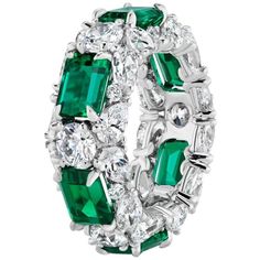 Designed as a 3 Row Bombay Shaped Ring, where you can see the different shaped stones from all angles. The Ring's main centerpiece is in the 6 fine Emeralds, each spaced out with 1 Round Diamond to highlight each Emeralds individual and intense beauty, with Pear and Round shaped diamonds on the border lines so as to make the Emeralds look as if a crown is holding them up. 6 Emeralds weighing approximately 6.03 Carats. 42 Diamonds weighing approximately 5.82 Carats. Finger Size 5. Can be made to Border Lines, Contemporary Ring, Modern Ring, Cluster Ring, Modern Jewelry, Round Diamond, Round Diamonds, The Row, Diamond Ring