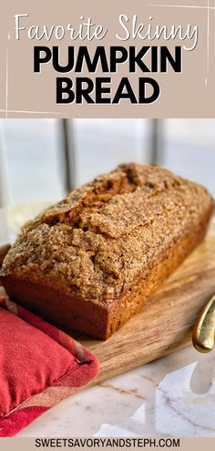 a loaf of pumpkin bread sitting on top of a wooden cutting board