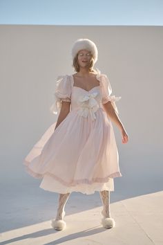 Shipping delay: Please allow 7-10 business days for this style to ship. Look as delectable as a cherry blossom-infused macaron in the Confection Cottontail—a blush cotton midi-dress with puff sleeves and a pleated skirt. The contrasting bows and luscious ruffles harken back to a New Year’s celebration amid French arist Cotton Midi Dress, Puff Sleeves, Pleated Skirt, Cherry Blossom, Puff Sleeve, Ruffles, Long Dress, Blossom, Cherry