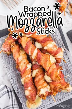 bacon wrapped mozzarella sticks on a plate with the words bacon wrapped mozzarella sticks