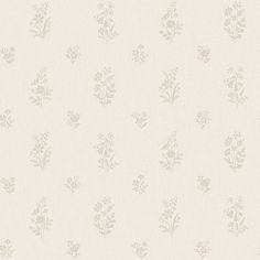 a white wallpaper with small flowers on it