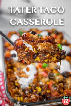 a spoon full of taco casserole with sour cream on top