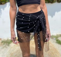 Sheer unlined sarong skirt. easy to shore over a bathing suit or worn as a skirt bandeau and under garnets sold separately one size black or white available