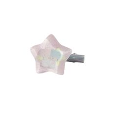 a white and pink star shaped object with a black handle on it's end