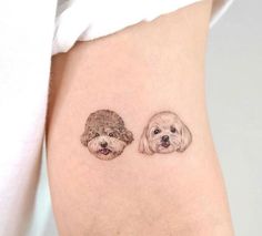 two small dogs on the side of a woman's thigh