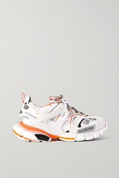 This white and orange iteration of Balenciaga's 'Track' sneakers will go with practically anything, from sweater dresses and sharp tailoring. Set on the signature chunky sole, they're made from rubber and mesh and detailed with the label's logo printed and debossed at the toe. The padded collars and tongue ensure a comfortable fit. -- Rubber sole measures approximately 50mm/ 2 inches - White mesh, multicolored rubber - Lace-up front - Imported Balenciaga Track Sneaker, Balenciaga Track Sneakers, Balenciaga Runners, Balenciaga Style, Rubber Sneakers, Balenciaga Women, Track Shoes, Balenciaga Sneakers, Balenciaga Track