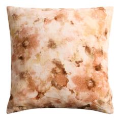 an orange and brown pillow on a white background