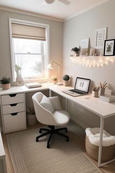 a white desk and chair in a small room with lights on the wall above it