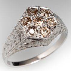 a fancy ring with brown and white diamonds