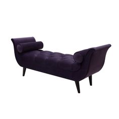 a purple couch sitting on top of a wooden frame