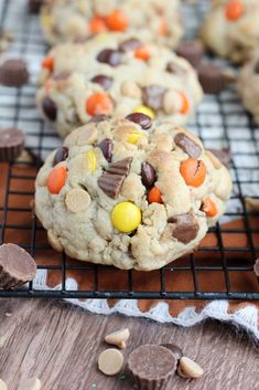 chocolate chip cookies with candy corn and m & m's on a cooling rack