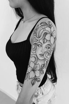 a woman with a tattoo on her arm