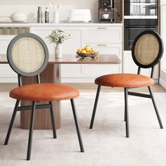 two chairs sitting next to each other in a kitchen