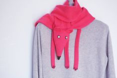 "Pink Fox shaped scarf, very fun, very long and very soft! Both for children and adults. Suits all sizes from 2-3 years. This scarf was knitted with 100 % acryl yarn. For other colors please give a look here http://www.etsy.com/shop/TreMelarance?section_id=12572113 Dimensions: 56\" (142 cm) x 4\" (10 cm) . --------------------------------------------------------- This item is made for order, please see my shop announcement for the current production time. If you need a rush order, please see my Pink Knitted Winter Scarves, Pink Knitted Scarves For Winter, Kids Scarves Knit, Scarf Kids, Fox Scarf, Scarf Knitted, Scarf Knit, Pink Fox, Baby Scarf