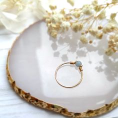 ✨ Blue Angelite Wire Ring, 14K Gold Filled, Rose Gold Filled, Sterling Silver, Tiny Gemstone Ring, Pinky RingSizing:• Gemstone Size: 4 mm• Ring Band: 0.8 mm • Handmade in your ring size with a natural gemstone bead. • Dainty & cute. The ring is slim and petite, yet durable to wear daily. • Gold-filled wire is known for its lasting quality. The ring will not tarnish or turn color. You can wear them every day or even in a shower.• Hypoallergenic. You won’t have to worry about allergies from metal Raw Crystal Ring, Single Stone Ring, Wire Ring, Guardian Angels, Wire Rings, Copper Pendants, Pendant Rings, Pinky Ring, Spirit Guides