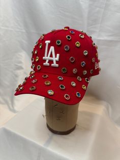 Rhinestone New Era SnapBack hat as seen on Chris brown during the 11:11 tour. Los Angeles dodgers hat. Made to order each stone is individually placed. Approx 16 different colored stones and approx 75 stones placed per hat. Each hat is unique and may differ from photos on listing.  if you're interested in a different color not listed or a different team it is subject to availability. Send me a message me for a custom order if available there will be a 3-5 days processing time. Bling Dodgers Hat, Custom Uggs, Junk Socks, Custom New Era Hats, Dodgers Hat, Fashionista Outfits, Streetwear Hats, Dodger Hats, Grey Hair Dye