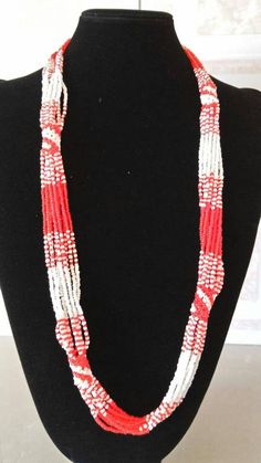 Red & White Necklace / African Jewelry / Handmade Jewelry / Zulu Necklace / Beads Necklace / Boho Necklace / Women's Gift / Tribal NecklaceThis statement  necklace is elegantly crafted.The necklace will make you stand out and can be worn in all occasions.Feel free to send me a convo or e-mail for any clarification or more information.Thank you for visiting, Traditional Red Necklace With Tiny Beads, Red Faceted Beads Jewelry For Beach, Traditional Red Hand-strung Beaded Necklaces, Multi-strand Red Necklace With Colorful Beads, Red Beaded Necklaces With Colorful Beads For Beach, Red Hand-strung Beaded Necklaces, Red Beaded Necklaces For Beach, Red Multi-strand Beaded Necklaces With Large Beads, Red Multi-strand Beaded Necklace With Large Beads