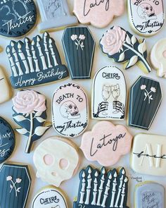 decorated cookies with names and pictures on them are arranged in a square pattern, along with other cookie designs