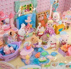 there are many toys on the table in this room, including teddy bears and other things