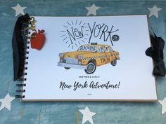 a new york city taxi cab is on the cover of a notebook