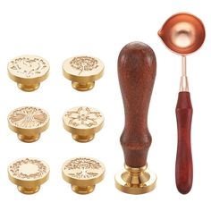 an assortment of brass knobs and handles with wooden handle, including a metal spoon