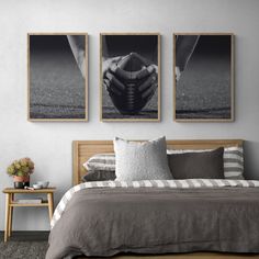 a bedroom with three pictures hanging on the wall