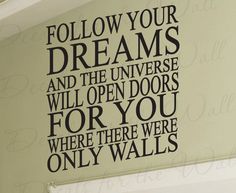 a wall with a quote on it that says follow your dreams and the universe will open doors for you where there were only walls