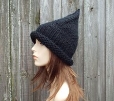 "Knitting Pattern: Witch Hat Finished Measurements: Circumference at brim band 19\" (48 cm) unstretched, 14\" (36 cm) in length from unrolled brim edge to tip of crown; will fit head circumference of 20\" - 23\" (50.5 cm - 58 cm) Yarn: 75 yds (69 m) super bulky weight #6 yarn (shown knitted in Lion Brand Wool Ease Thick and Quick) Needles and Other Materials One 16\" (40.5 cm) circular knitting needle size US 13 (9 mm) or size needed to obtain gauge US 13 (9 mm) set of 5 double-pointed needles o Hat Halloween Costume, Black Witch Hat, Halloween Hat, Wizard Hat, Crochet Santa, Chunky Knit Hat, Gnome Hat, Mens Hat, Pixie Hat