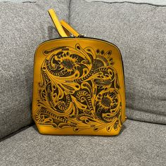 Yellow Tooled Leather Backpack Nwot Rectangular Yellow Backpack For Daily Use, Yellow Rectangular Backpack, Yellow Rectangular Backpack With Adjustable Strap, Yellow Travel Shoulder Bag Backpack, Yellow Satchel Backpack For Daily Use, Yellow Shoulder Backpack With Adjustable Strap, Gold Leather Backpack, Everyday Rectangular Yellow Backpack, Everyday Yellow Rectangular Backpack