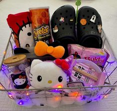 a hello kitty gift basket filled with shoes and candy