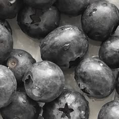 some blueberries are sitting together on the table