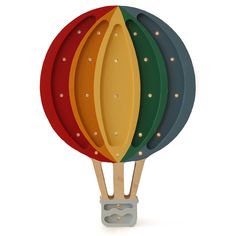 four paddles are stacked on top of each other in the shape of a hot air balloon