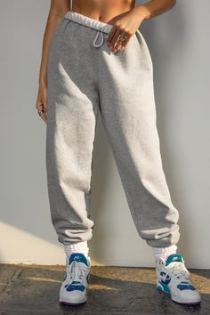 Jogger in an oversized silhouette with an elastic waistband and gathered ankle cuffs. Features an adjustable hidden drawstring at the waist. Custom knit french terry fabric Brushed mid-weight cotton - ideal for layering Soft, comfortable and made to last Color: Classic Grey French Terry Sizing: X/S (0-2), S/M (4-6), M/L (8-10) Model is 5'8" and wearing size X/S Fabric: 97% Cotton, 3% POLYESTER Care: Machine Wash Cold With Like Colors.Care: Tumble Dry Low. JOAH BROWN | MADE IN LOS ANGELES Brown Joggers, Cable Knit Socks, Joah Brown, Classic Grey, Terry Fabric, French Terry Fabric, Ankle Cuffs, Oversized Silhouette, Knitting Socks