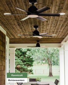 the ceiling fan is hanging from the ceiling in front of an outdoor dining table and chairs