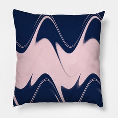 a blue and pink pillow with an abstract design on the front, featuring wavy lines