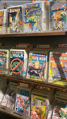 comic books are on display in a store