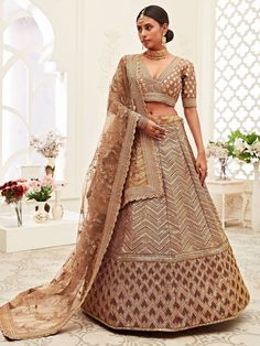 <ul>

<li style="text-align: justify;">Steal the show by wearing this brown color lehenga in slub silk material heavily embellished with all-over sequins,  dori, zari embroidery work featured with heavy zig-zag border work comes with attached can-can inside.   </li>
<li style="text-align: justify;">Paired with similar choli with lace border and soft net embroidered dupatta with cutwork lace. </li>
<li style="text-align: justify;">Be the trendsetter in this des Bridal Lehenga Indian, Golden Lehenga, Lehenga Choli Latest, Lehenga Choli Designs, Indian Wedding Lehenga, Bridal Wardrobe, Sabyasachi Lehenga, Lehenga Choli Wedding, Lengha Choli